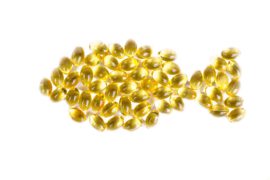 Fish oil tablets, helpful for keeping a healthy omega-6:3 ratio, formed into the shape of a fish